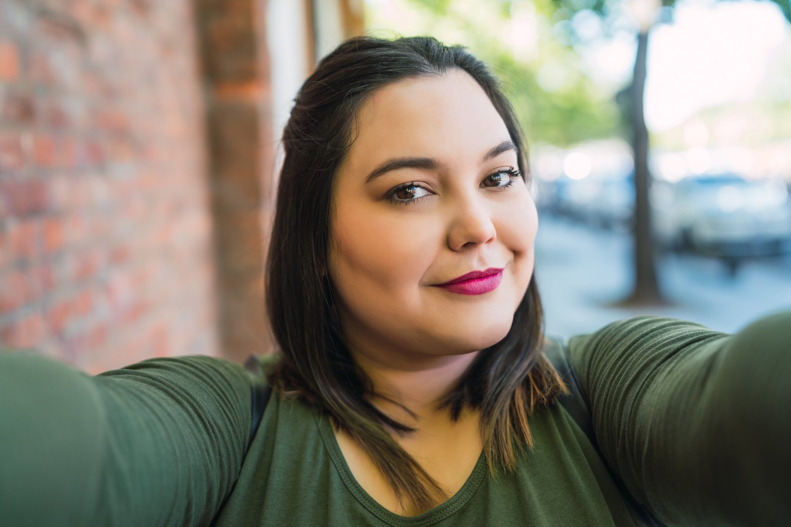 Young plus Size Woman Taking a Selfie.